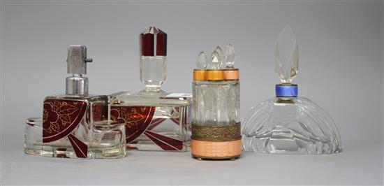 An Eastern European ruby overlaid glass scent flask and matching casket, a cut glass scent bottle with blue enamelled collar and